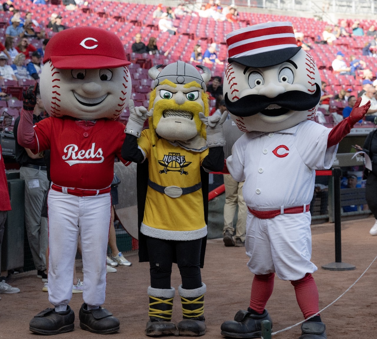 Victor Viking mascot posing with Cincinnati Reds mascots Mr. Red and Mr. Redlegs