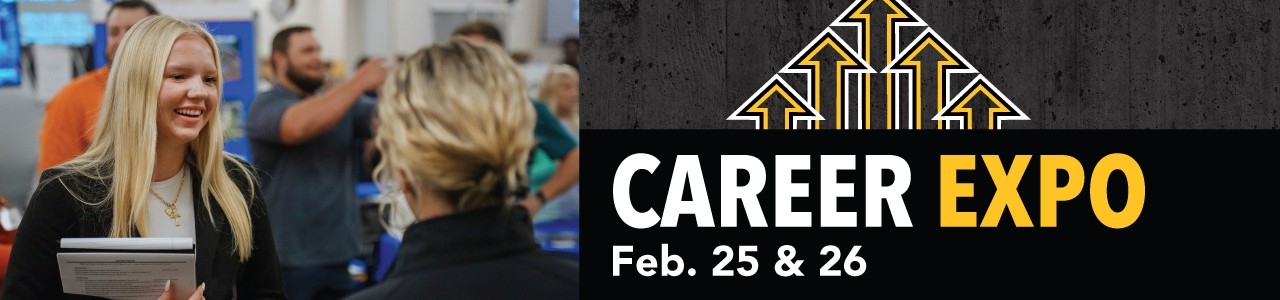 An employer and a student talking at a Career Fair