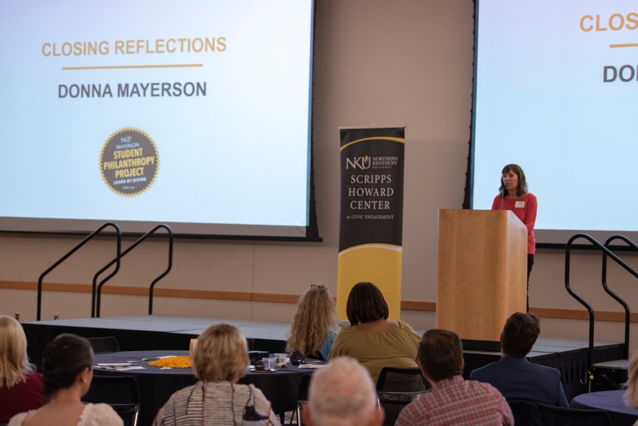 Speaker Donna Mayerson giving closing remarks at Scripps Howard Center presentation.