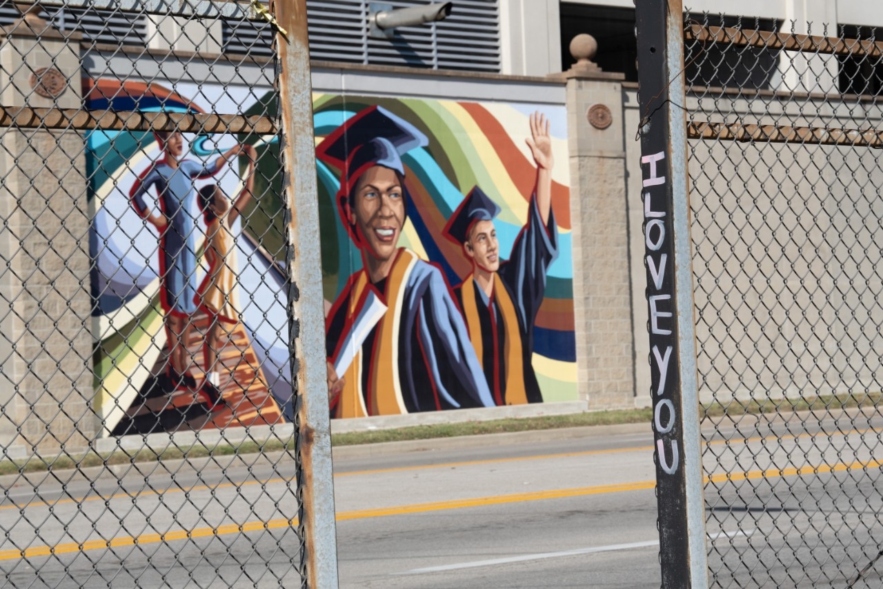 Painted mural depicting graduating students.
