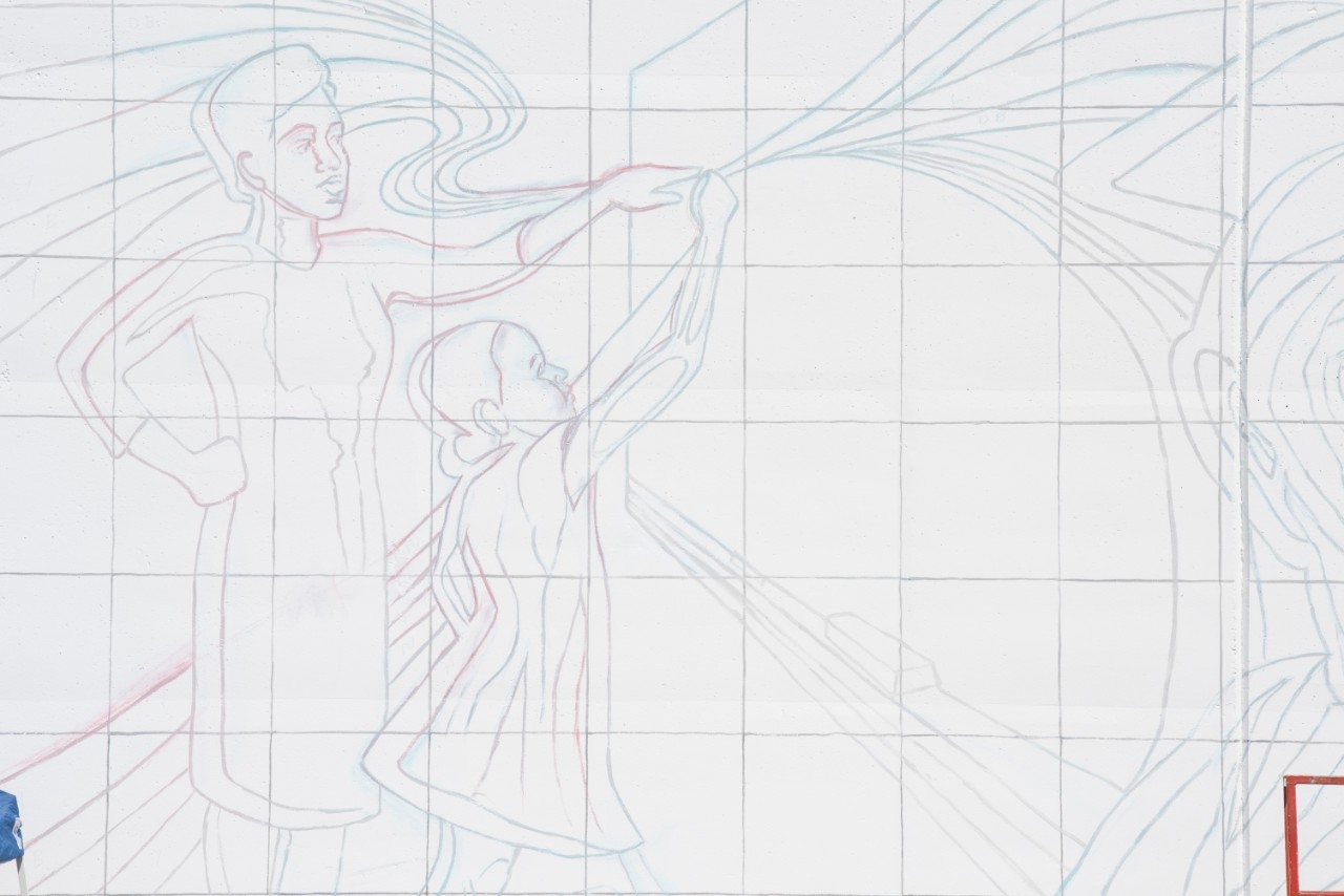 Close up of the outline of a mural.