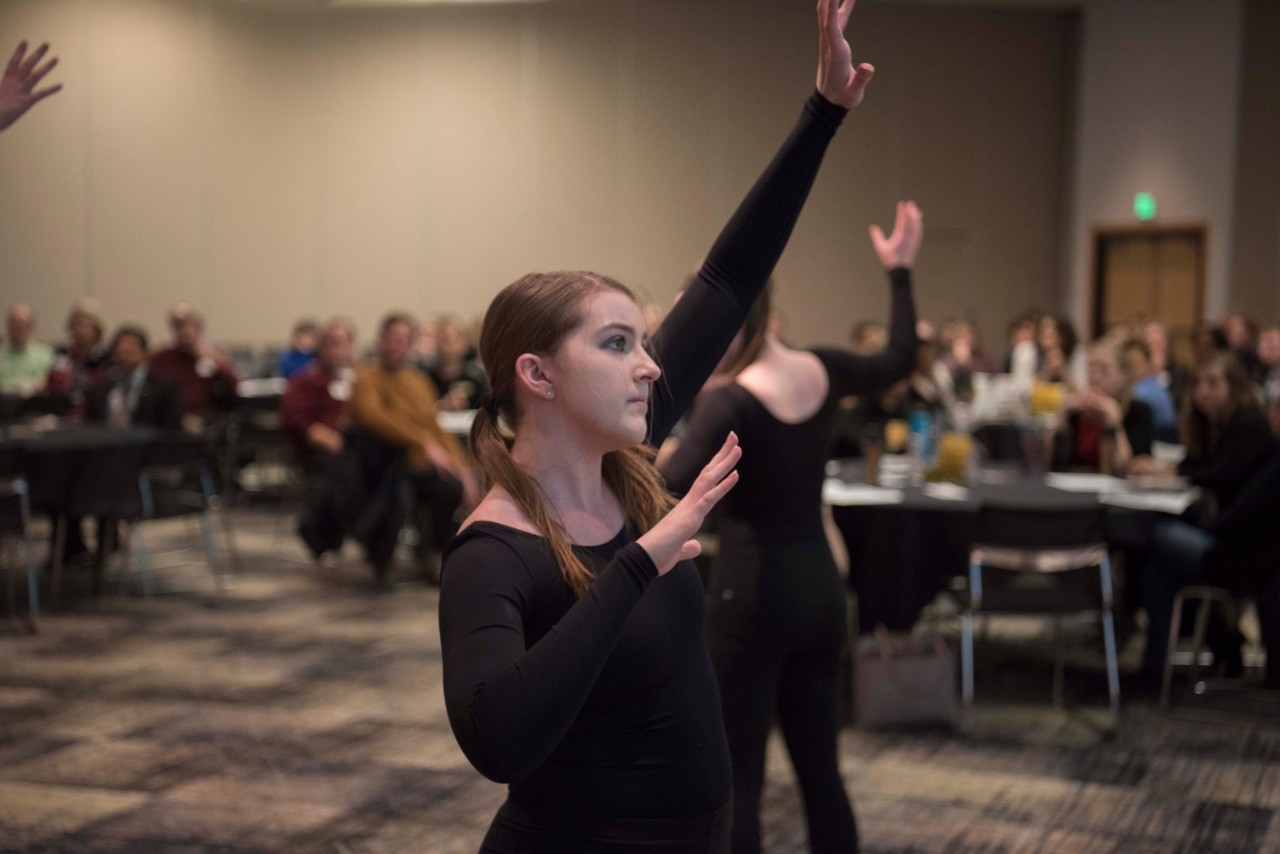 Students giving a dance presentation.