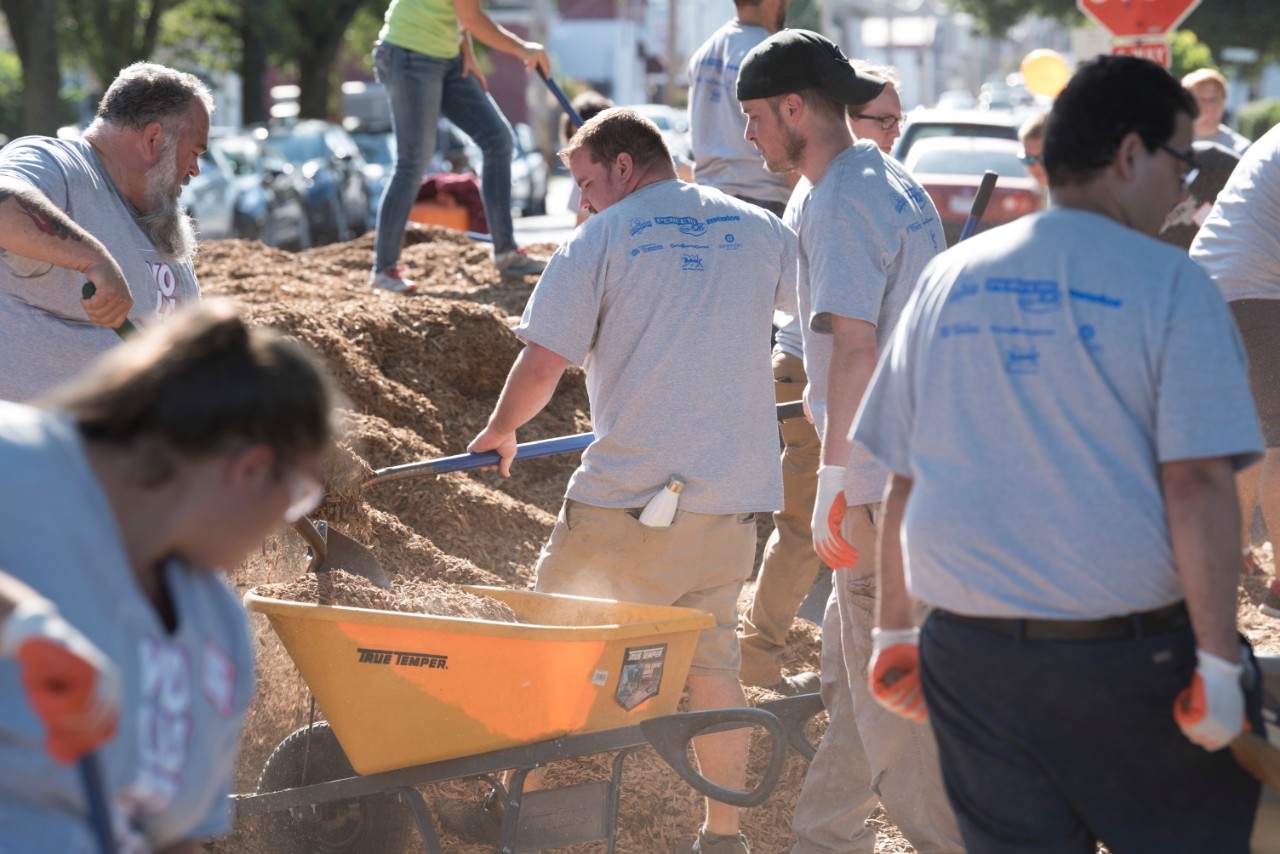 Volunteers shoveling dirt