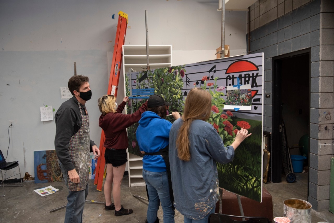 Painters working on mural.