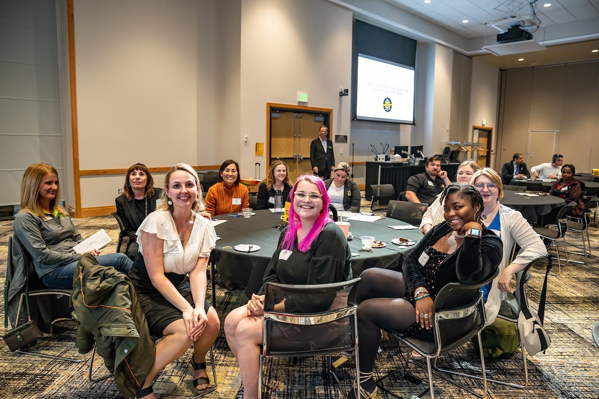 Class posing at a table.