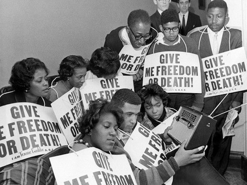 Some of the 33 persons on a hunger strike in the state Capitol pass the time listening to their radio in Frankfort, Kentucky, March 20, 1964