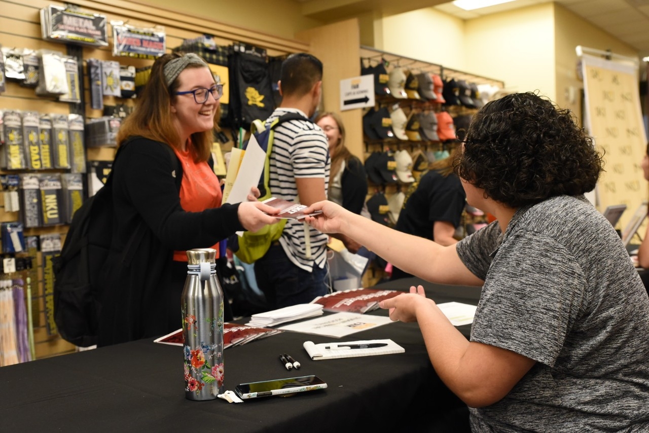 Staff assisting student at the NKU Campus Bookstore