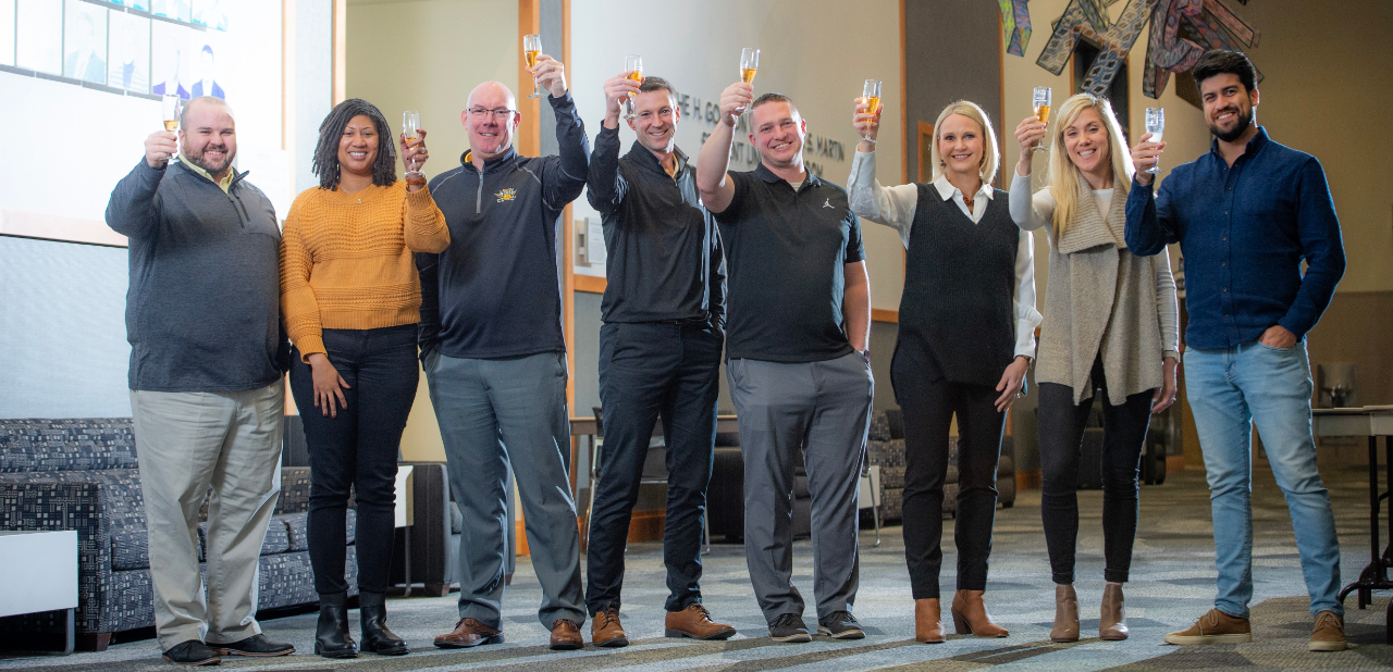 Group of adults giving a champagne toast