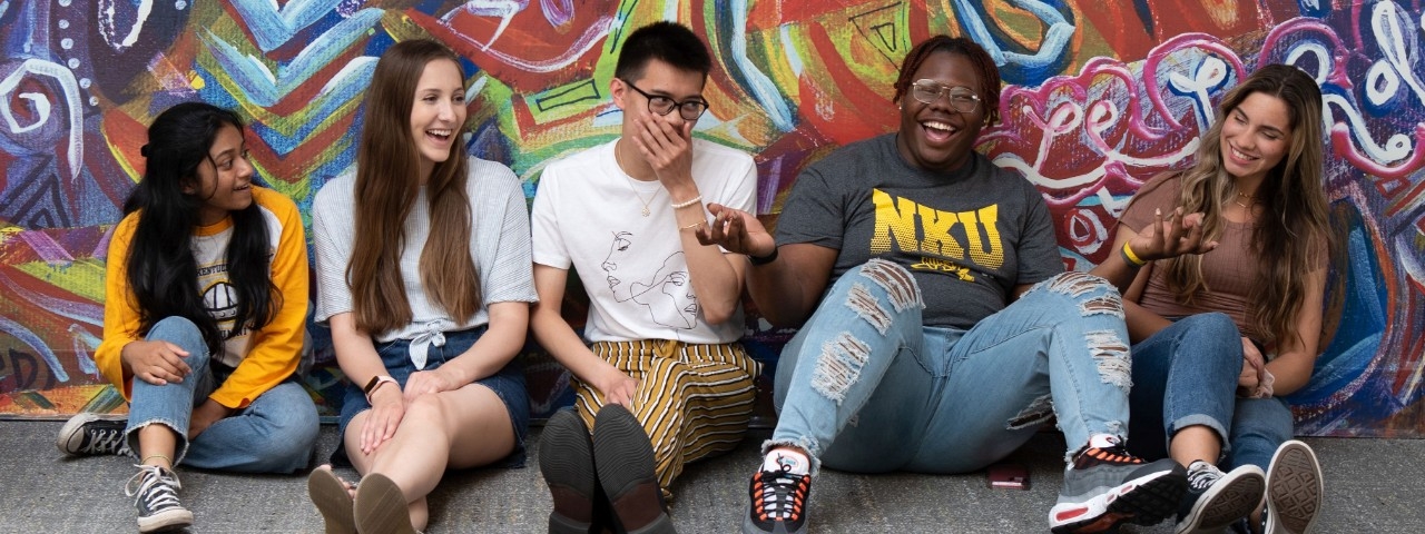 Students in front of mural