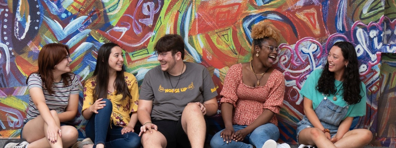 Students in front of mural