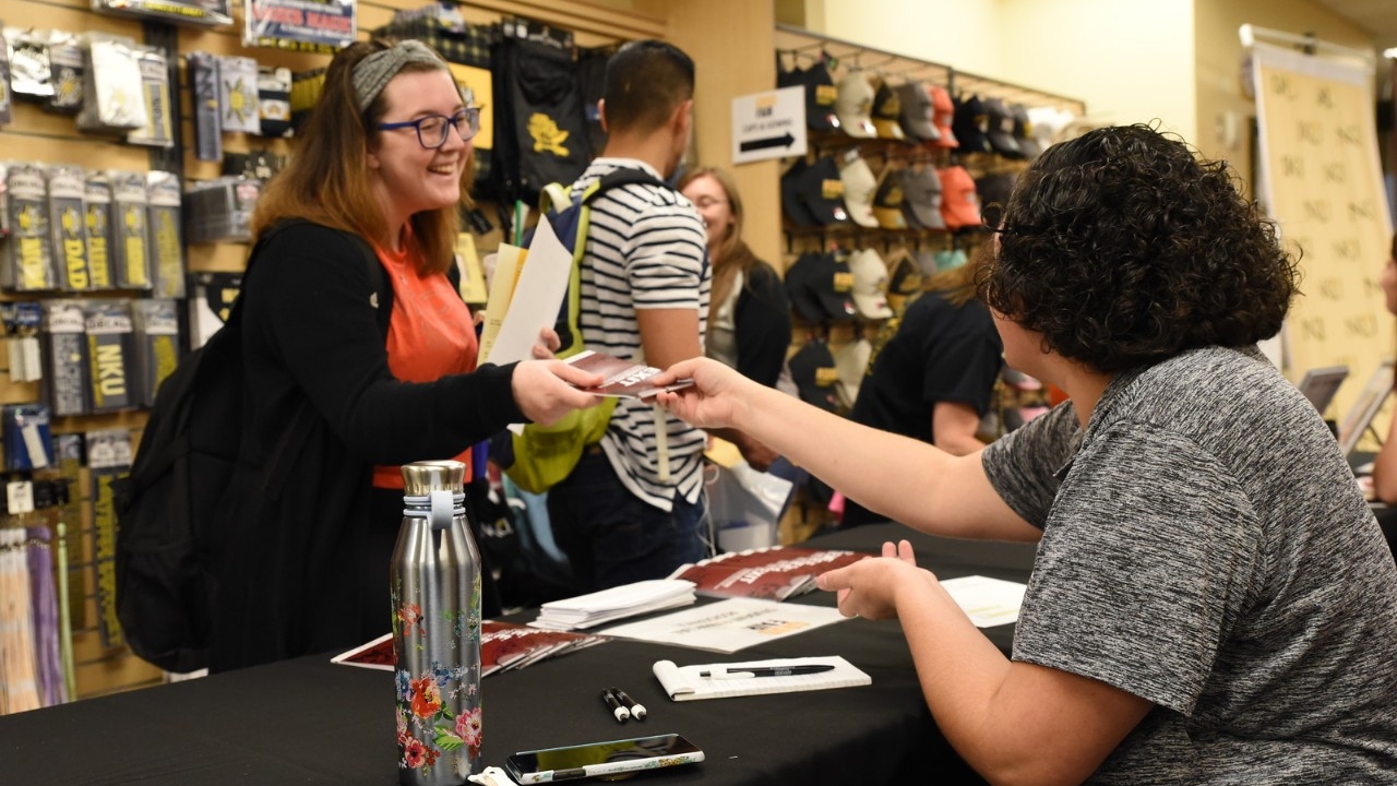 A student working at the NKU Bookstore