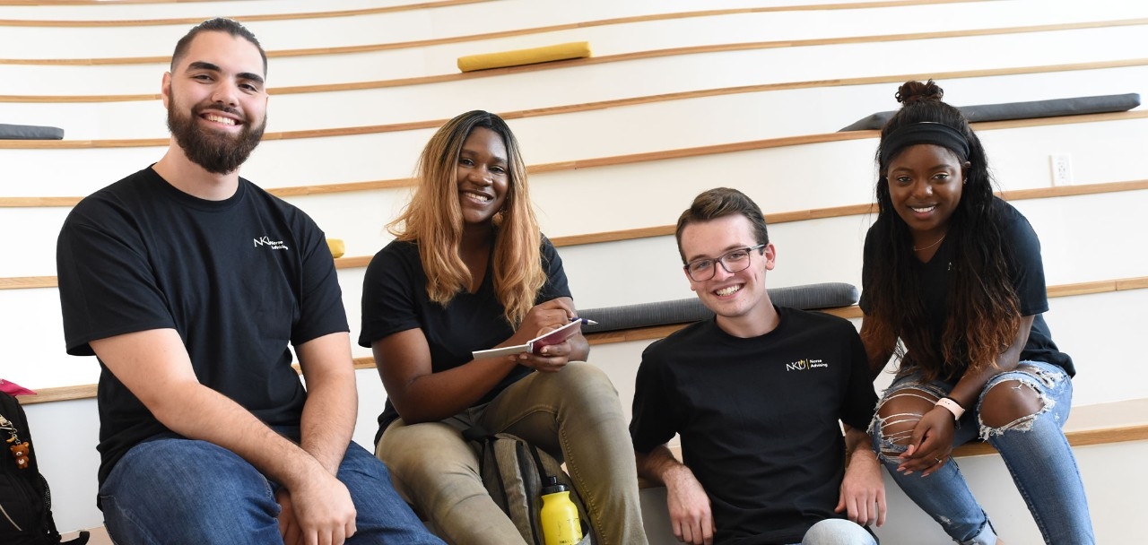 NKU Students sitting on steps