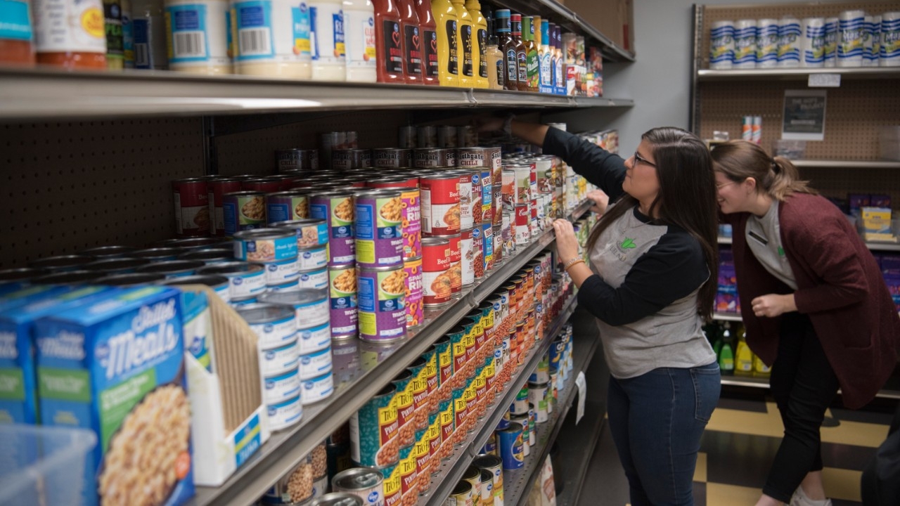 FUEL NKU workers re-stock shelves with items