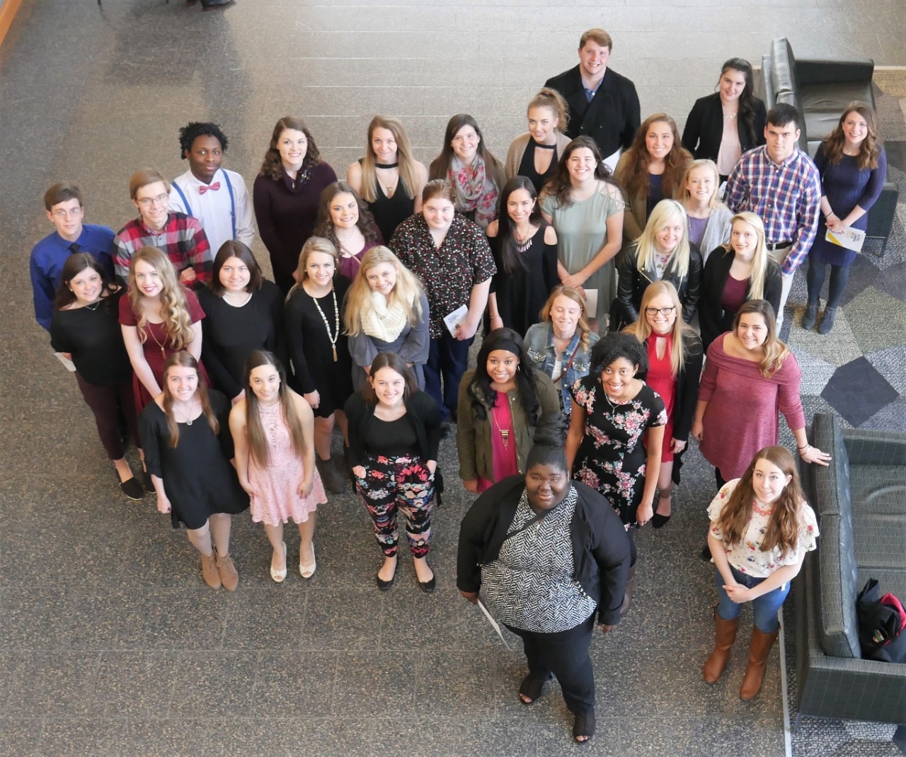 Group of students standing in lobby of Student Union