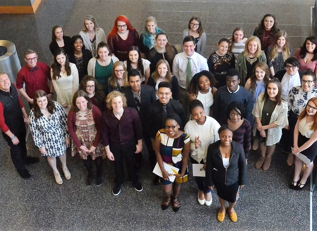 Group of students standing in Student Union lobby.