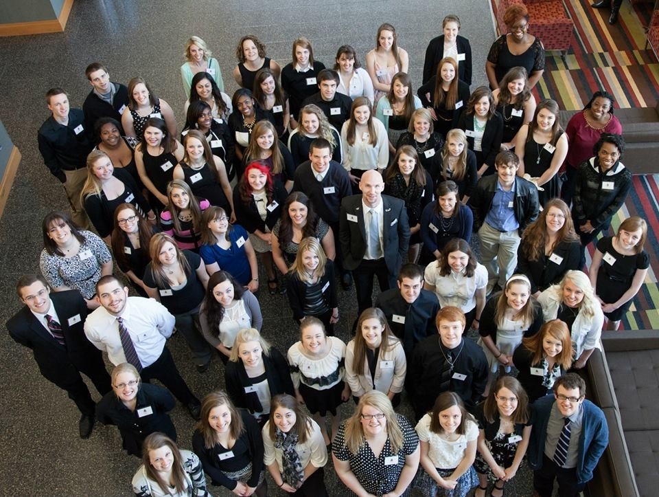 Group of students standing in Student Union lobby.