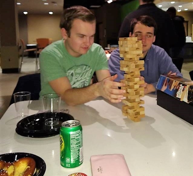 Two students playing Jenga