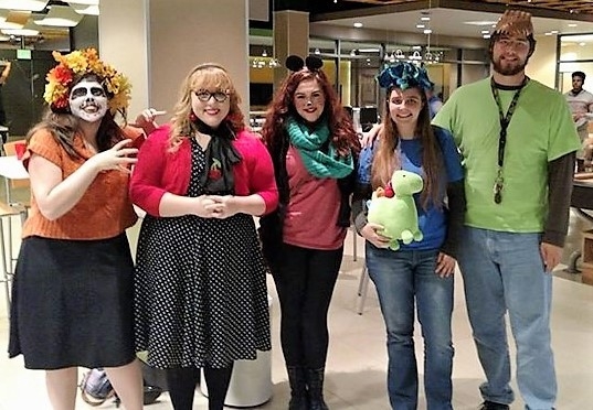 Five students dressed in Halloween costumes