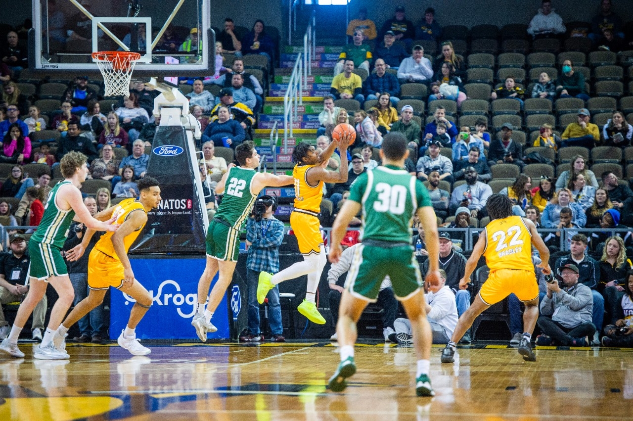 NKU male athletes competing in a basketball game. 