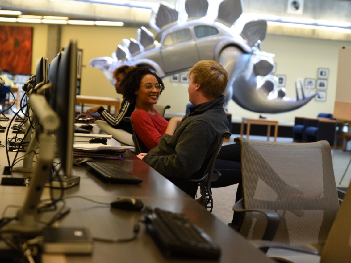 Students hanging out inside Steely Library