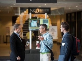 Faculty members talking at Celebration