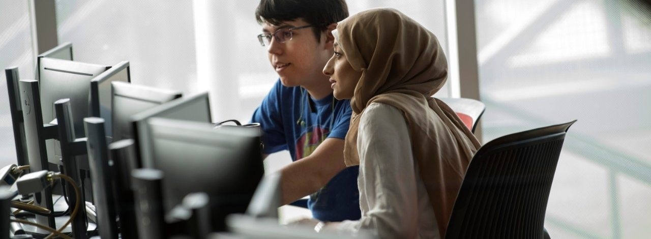 Students sitting in computer lab looking at screen