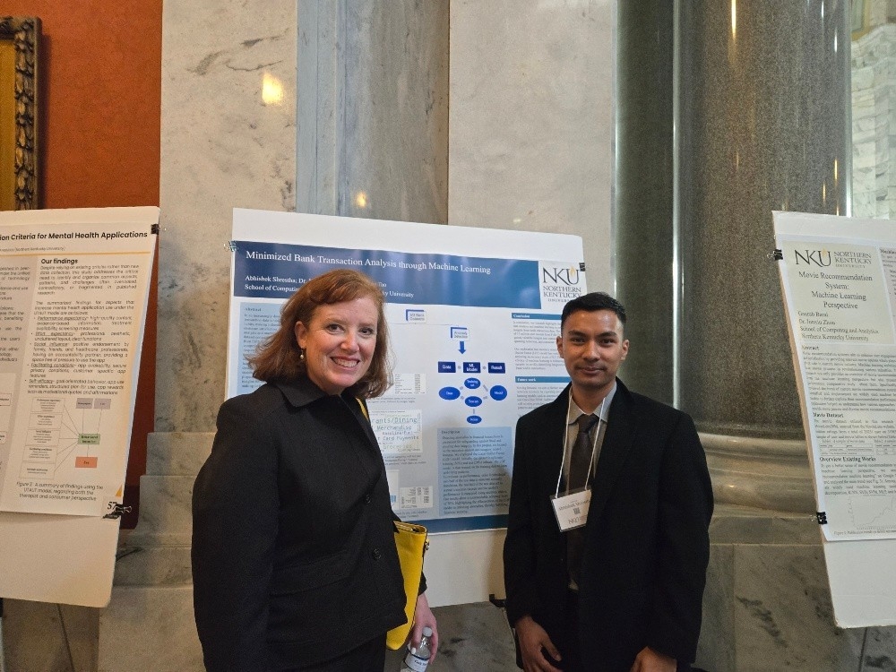 Student presenting to President Short-Thompson