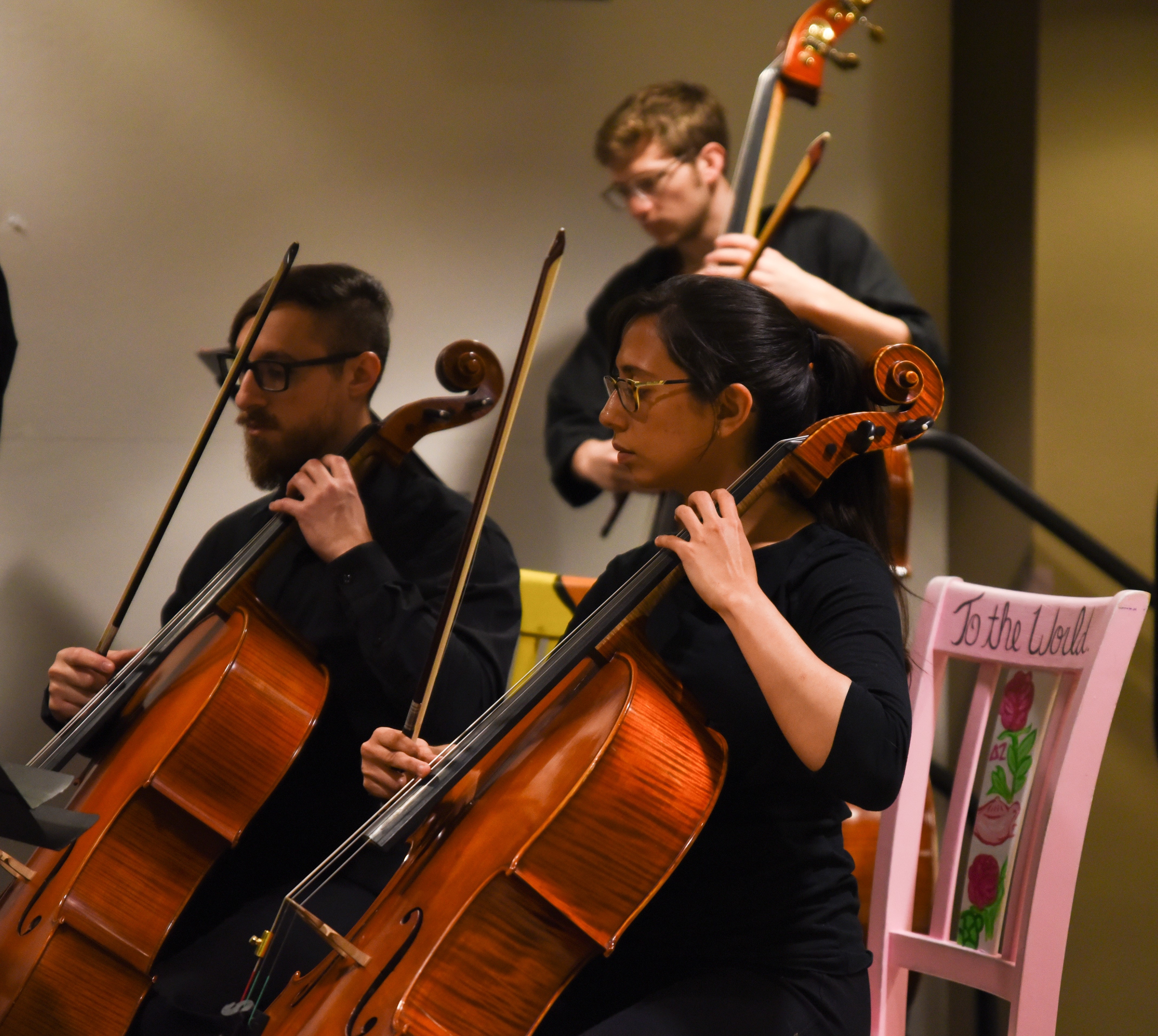 students playing cellos