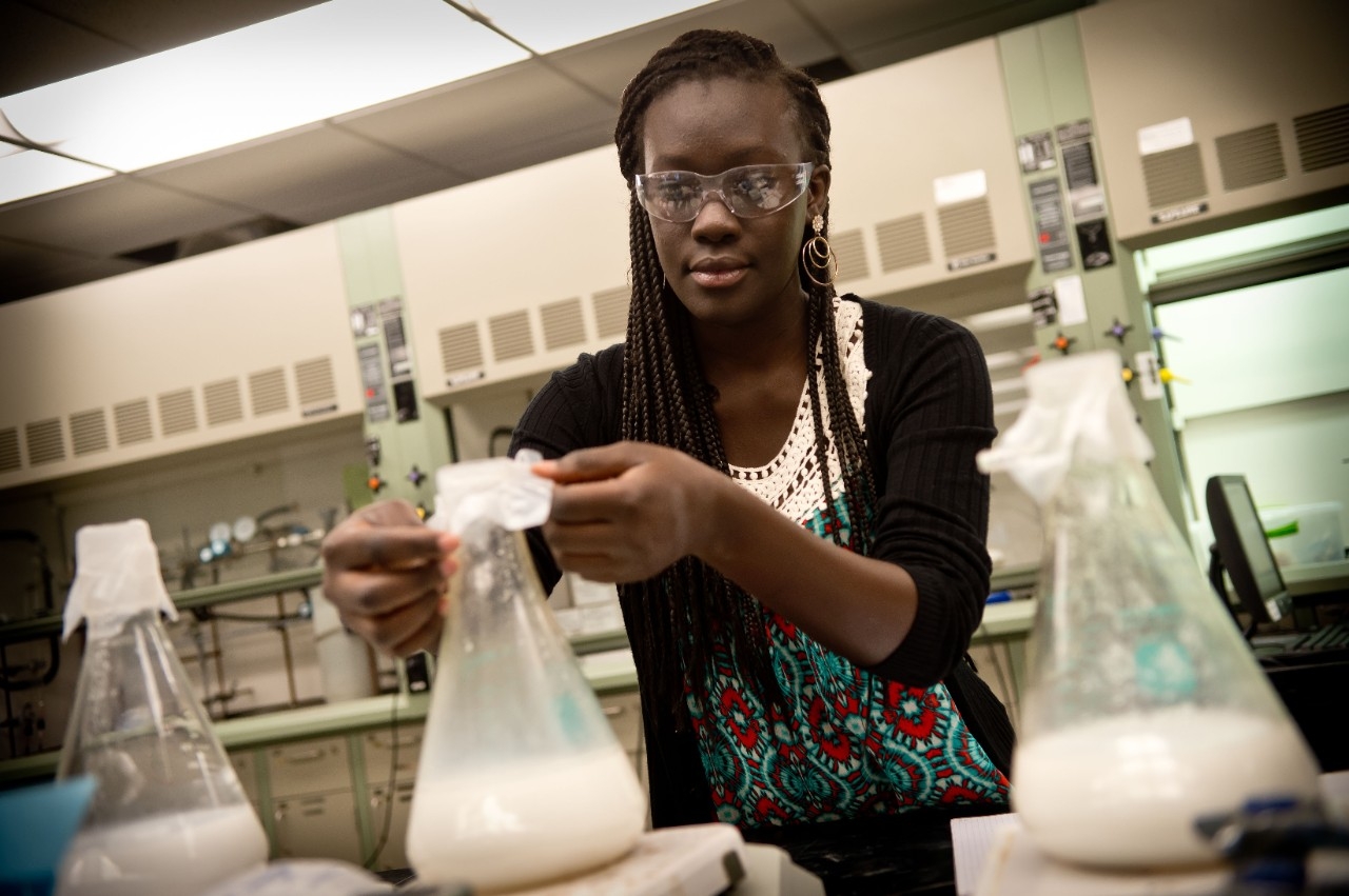 International student working in a chemistry lab.