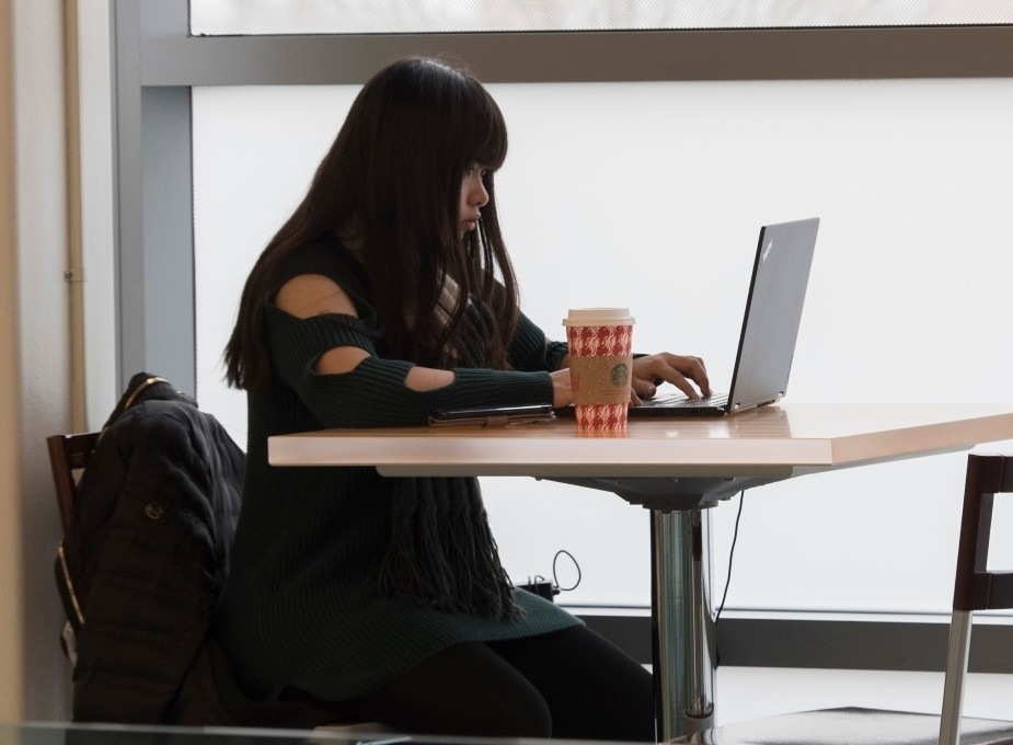 An NKU Student using their laptop.