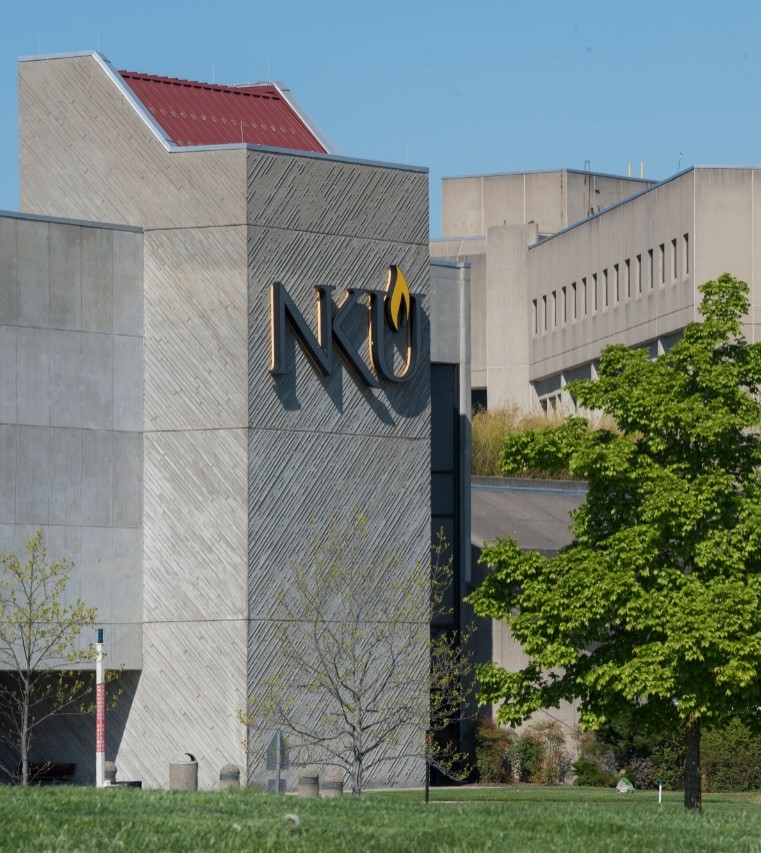 Scenic view of NKU's Steely Library building showing the NKU logo on the building side.