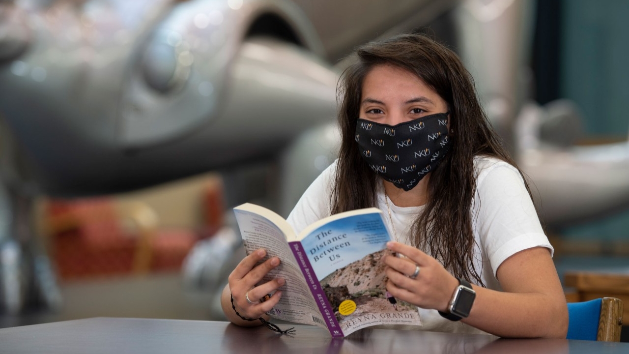 Students reading a book in Steely Library