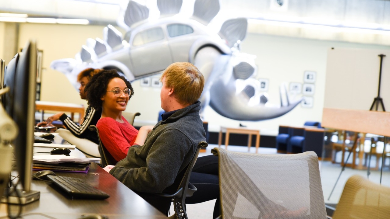 Students sitting at computers by Stego