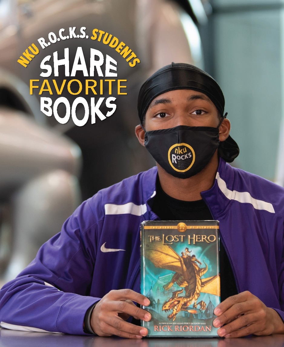 Brincent Mitchell with his book, “The Lost Hero” by Rick Riordan