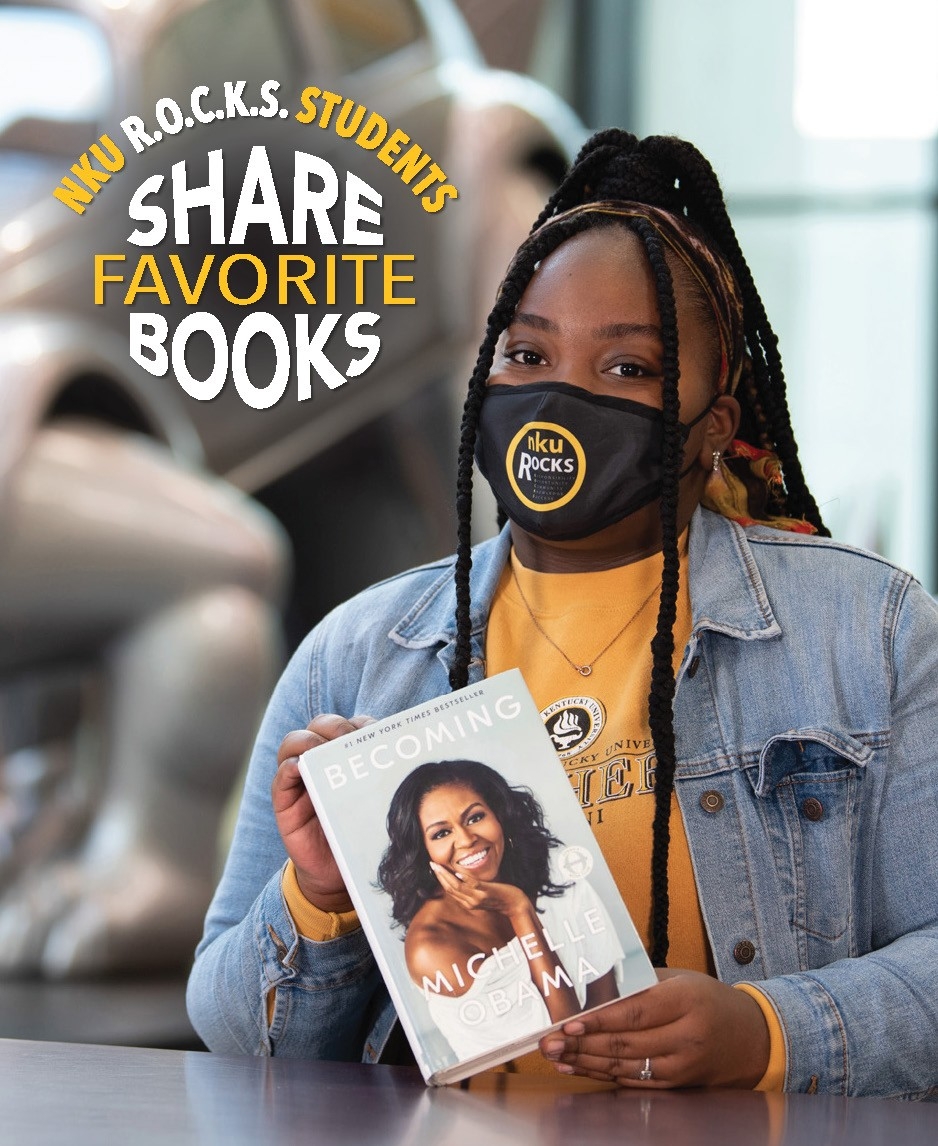 Amari Brandy poses with her fav book, “Becoming” by Michelle Obama 	