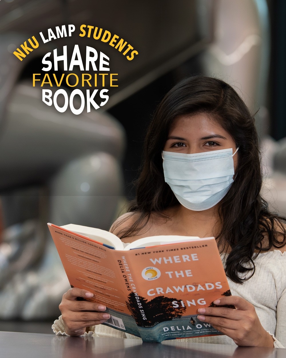 Azelin Gutierrez poses with her book, "Where the Crawdads Sing" by Delia Owens