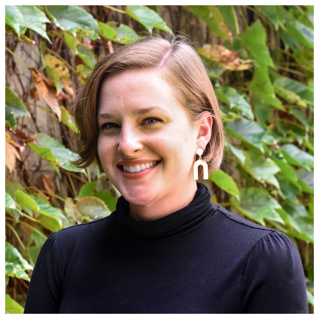 Headshot of Julia Pitts in front of green vines