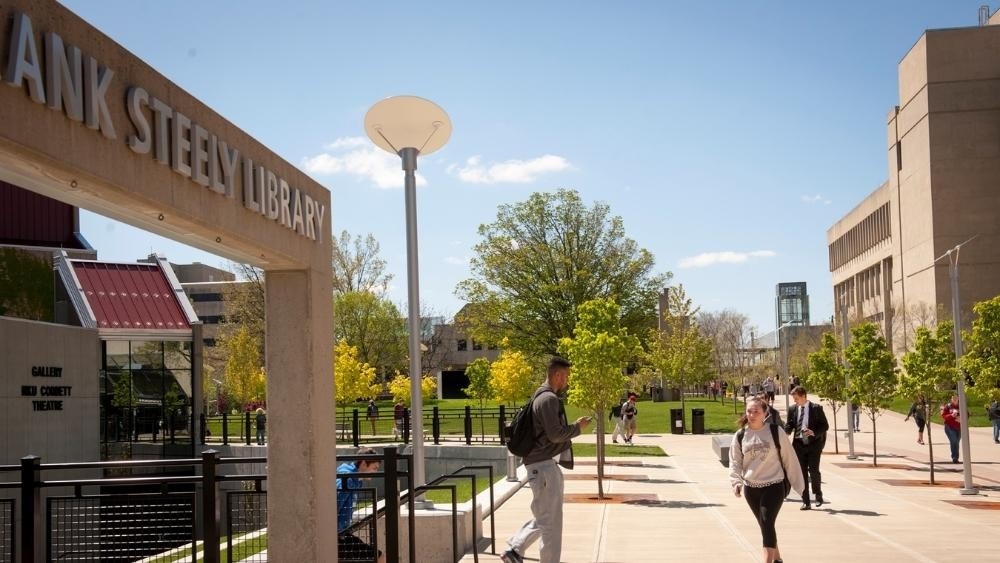 Exterior image of Steely Library with students walking on the sidewalk