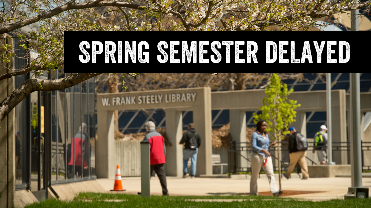 Spring time image of the exterior of Steely Library with a text overlay stating "Spring Semester Delayed"