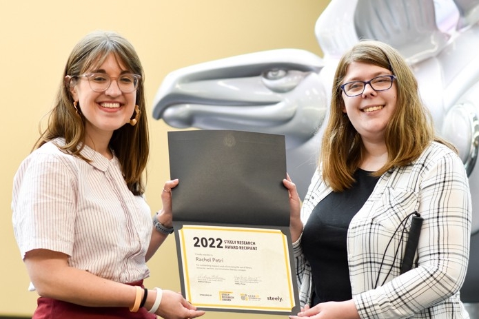 Rachel Petri and Hailley Fargo pose with the Steely Research Award certificate.