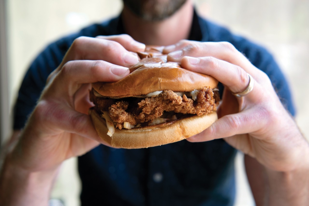 Man holding a chicken sandwich