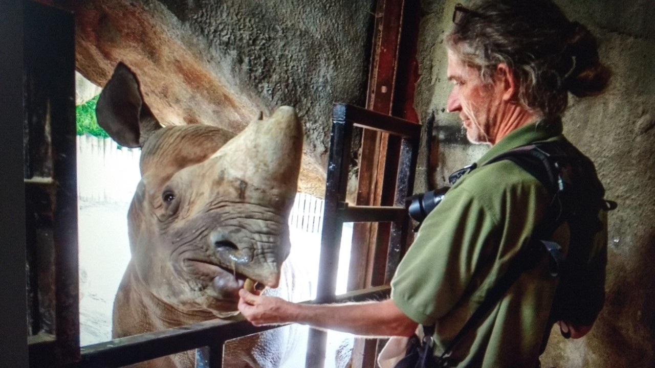 Jeff McCurry with rhino at Cincinnati Zoo