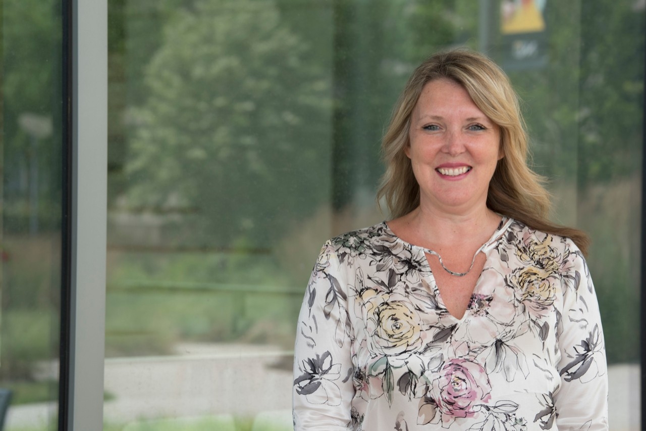 Megan Vasseur, NKU alumna, standing in front of NKU's Health Innovation Center