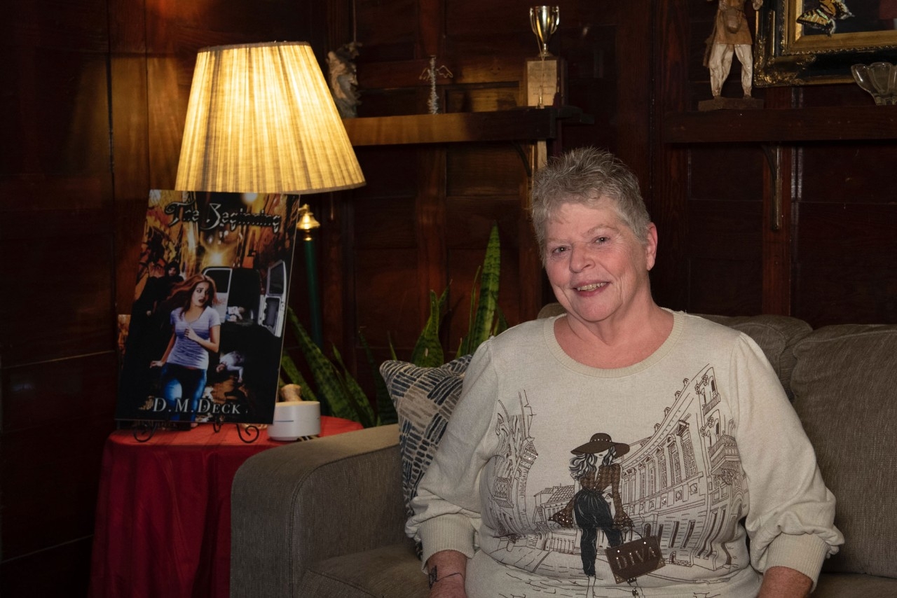 Donna Deck sitting in living room