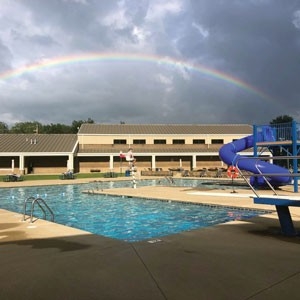 Rainbow over public pool