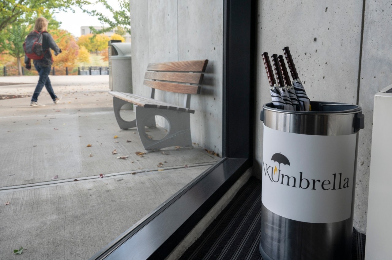 A bucket of NKU umbrellas in the lobby of the University Center