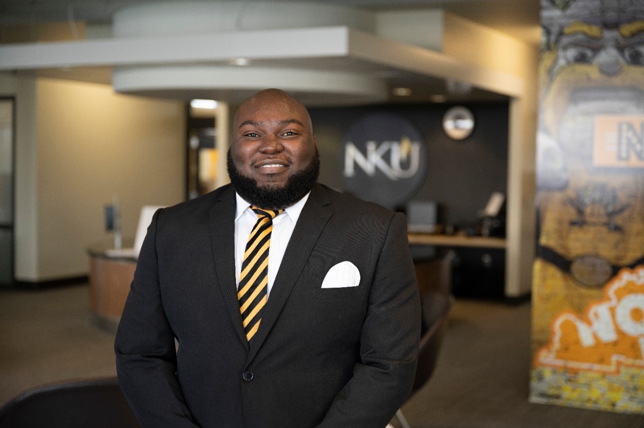 Javance Sinclair stands in front of office in the Student Union.