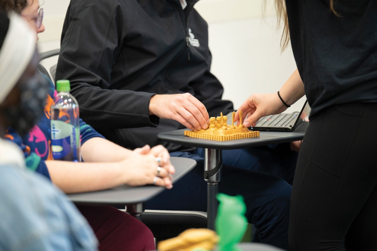 Students handling 3D printed product