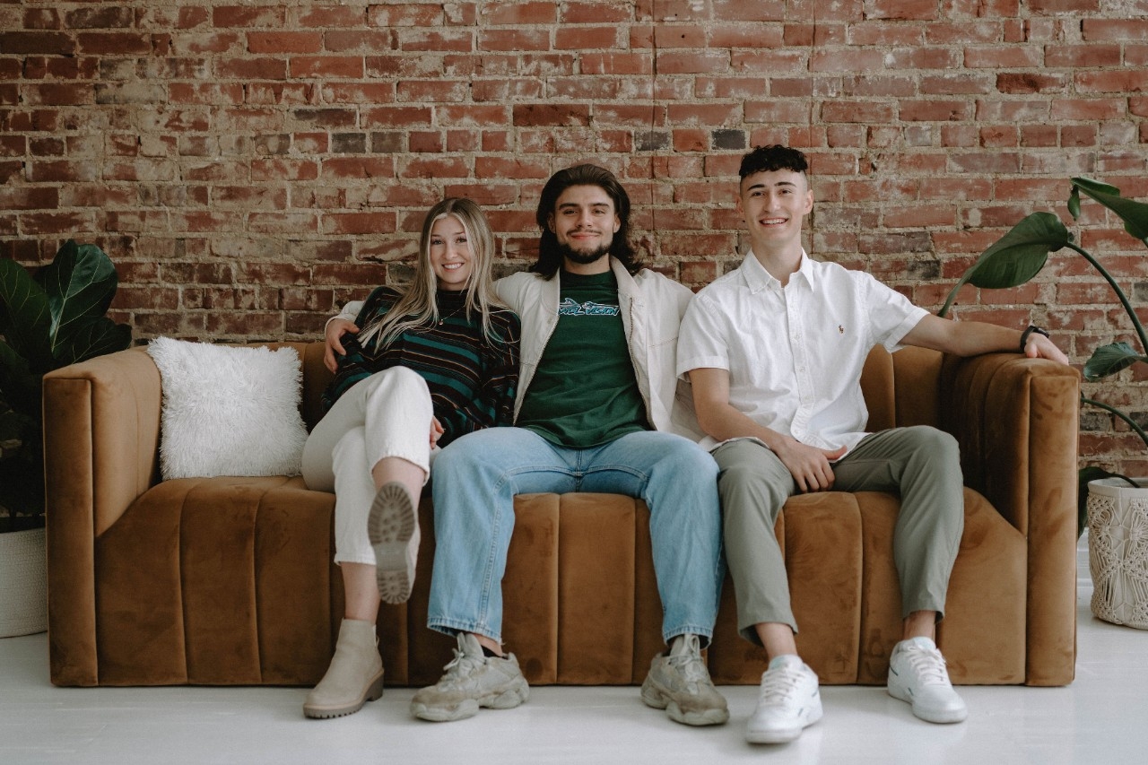 The members of Sonder Media on a couch