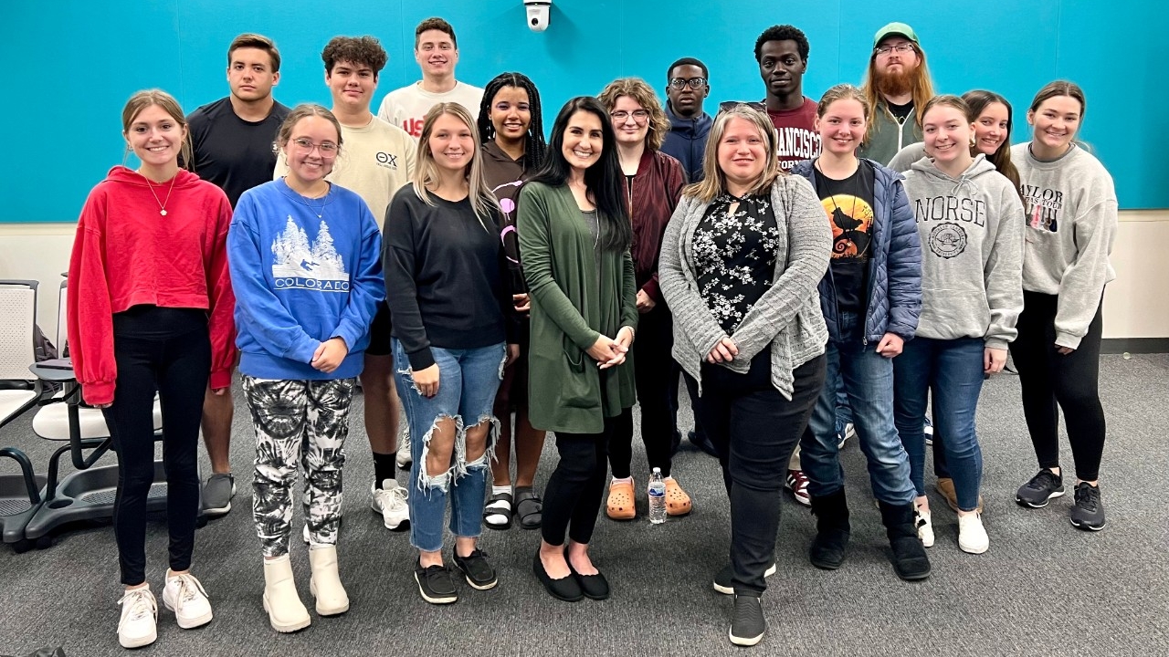 A photo of Dr. Terhune's class gathering for a picture in the classroom.